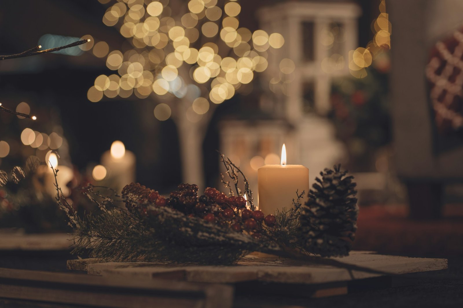 Candles and pine cones on a table