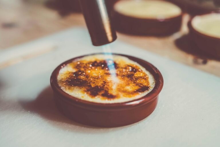 A custard being caramelised with a torch