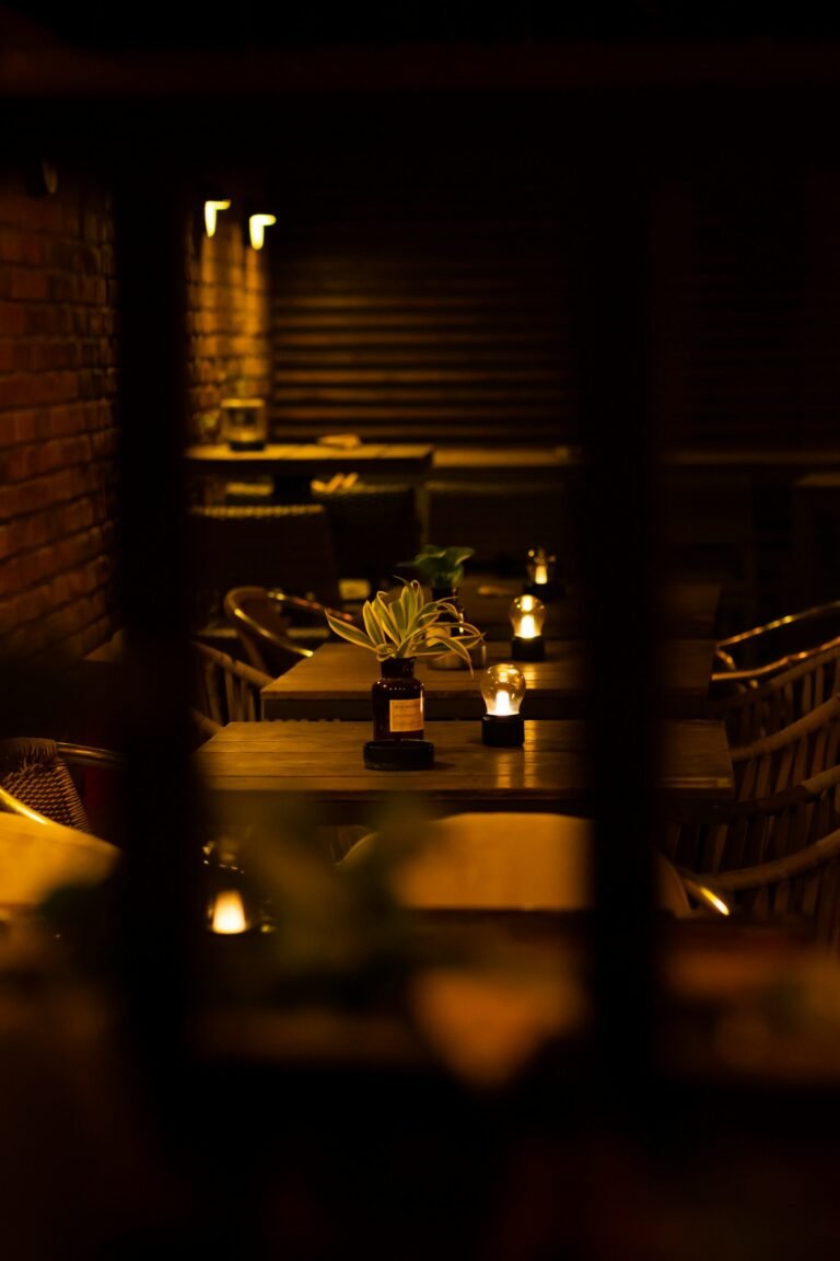 A dimly lit dining room with wooden tables